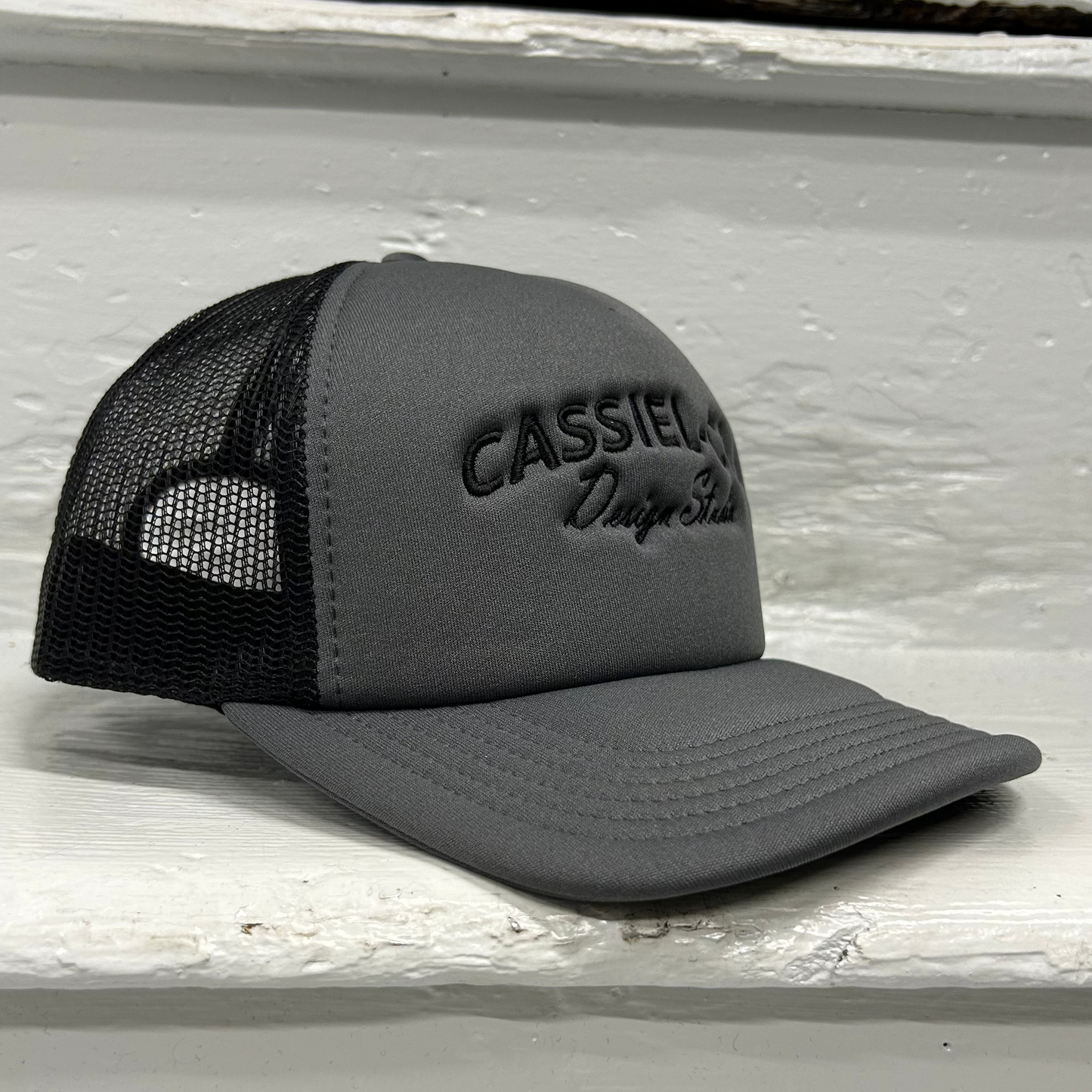 Cassiel Arch Logo Grey Foam Trucker Cap