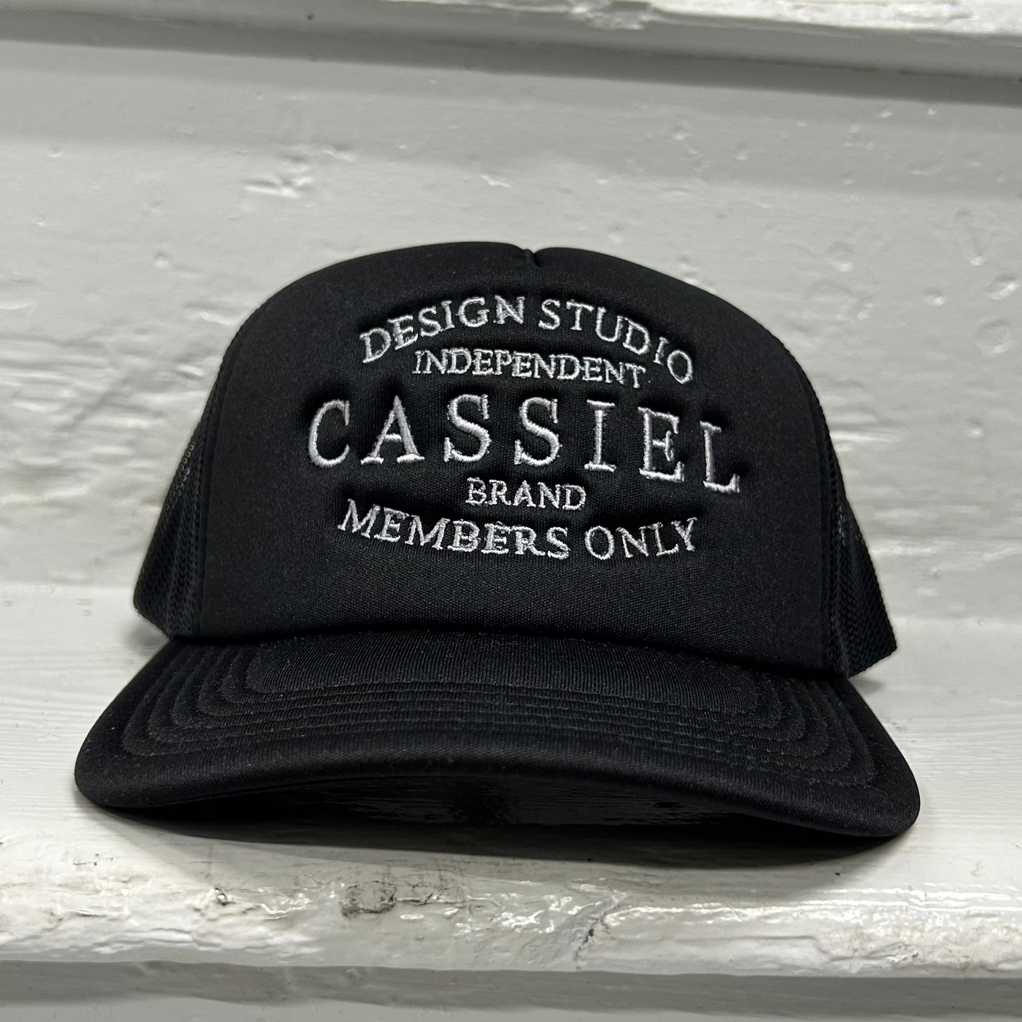 Cassiel Brand Logo Black Foam Trucker Cap