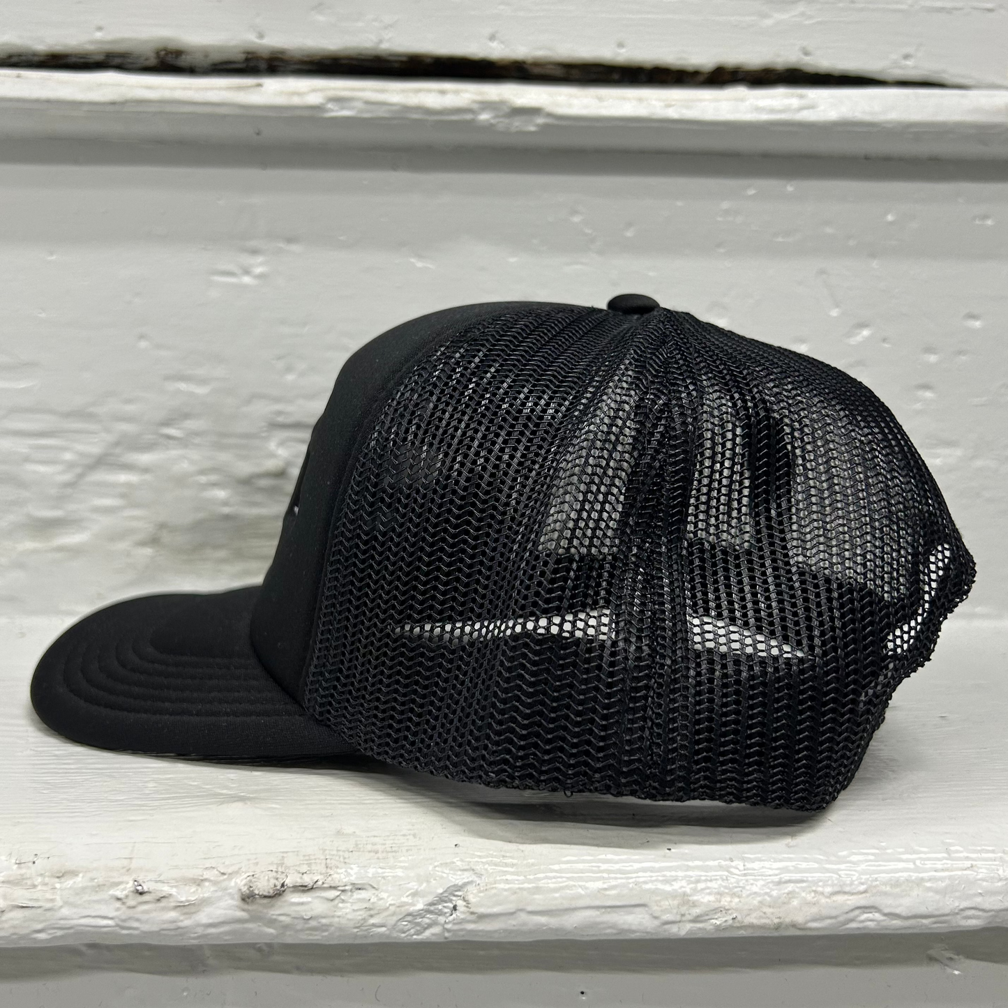 Cassiel Brand Logo Black Foam Trucker Cap